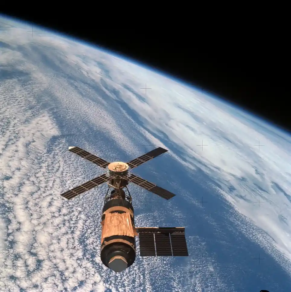 Skylab space station orbiting Earth, captured with Earth limb in the background